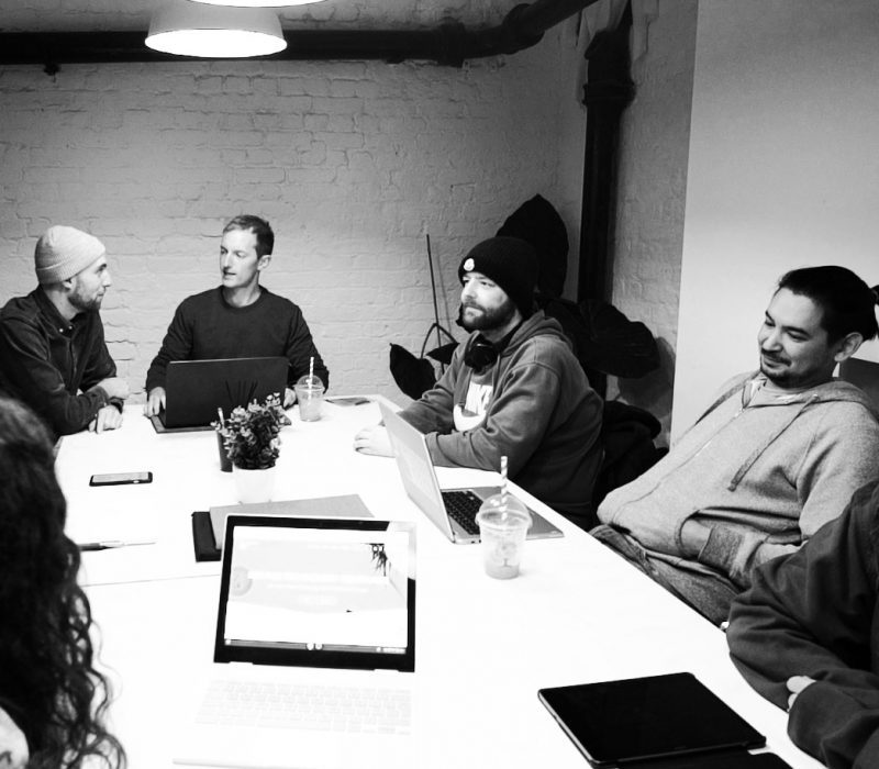 The GeekyTech team having a meeting, discussing B2B Marketing