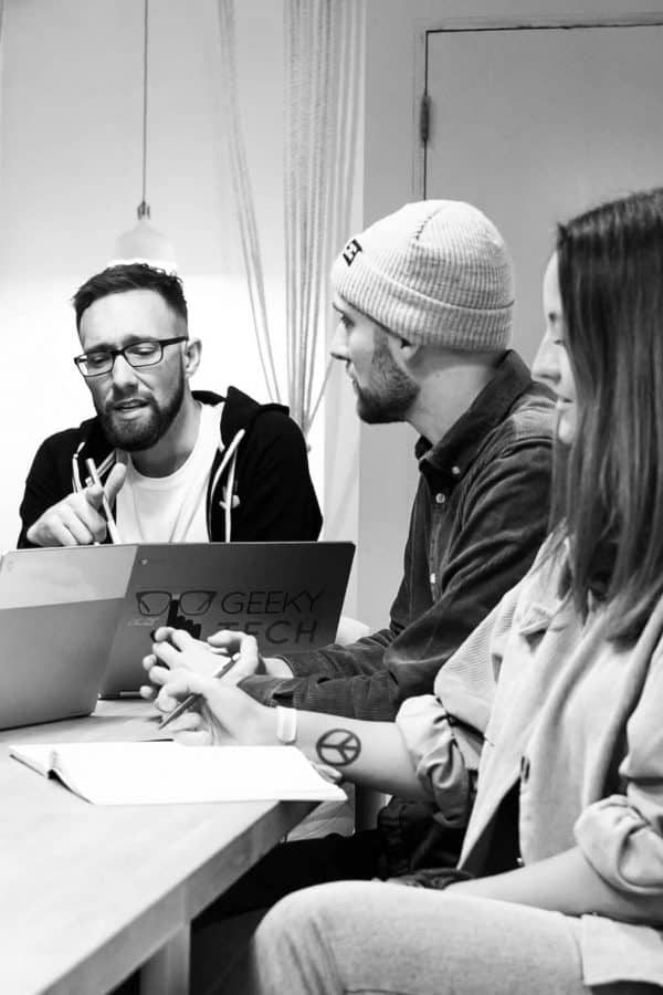 Three members of the GeekyTech team, Ben, Mark and Chloe in a meeting discussing B2B SEO Strategy