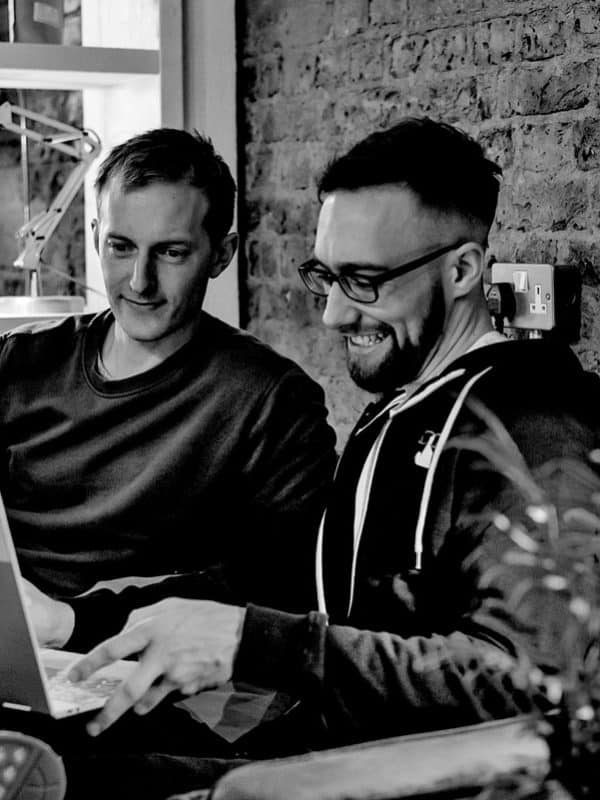 Ben-and-Alan-discussing-customer-B2B-PPC Ben and Alan, members of our B2B PPC Agency, discussing upcoming projects