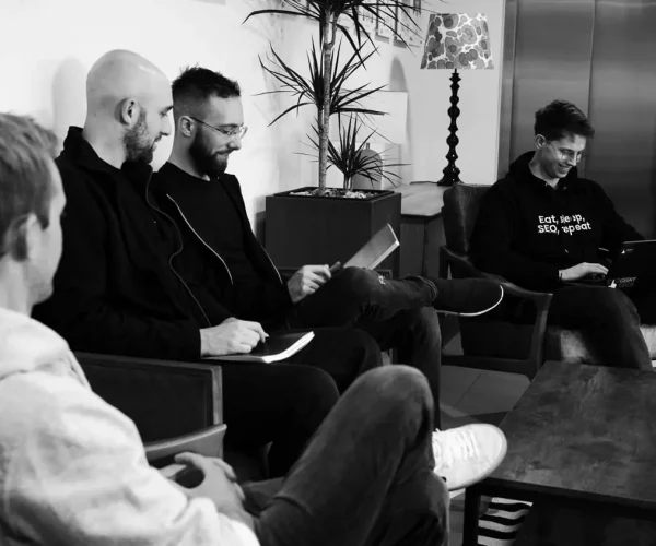Marketing experts discussing SEO for blockchain strategy